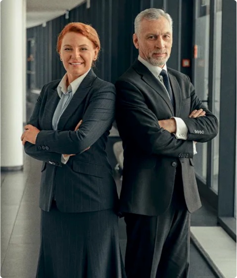 Two business professionals standing together