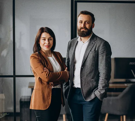 Two business consultants standing in a modern office