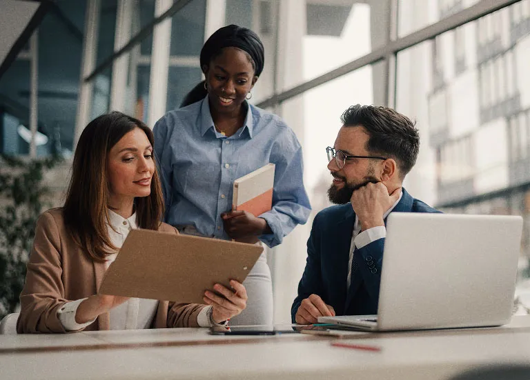Business team discussing plans in a bright office